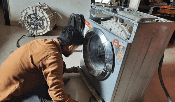 Revamp technician repairing front load washing machine in Wakad, Hinjewadi